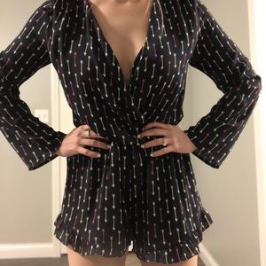 Honey punch long sleeve romper with arrow design
